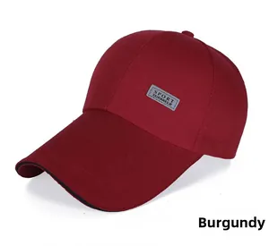 Detail of wine red canvas baseball cap with long visor and reflective SPORT patch