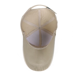 Beige canvas baseball cap with extended brim and adjustable metal buckle closure