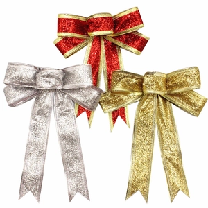 Sparkly glitter Christmas bows in red, silver and gold for holiday tree decoration