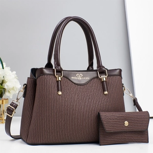 Brown pleated handbag and wallet set with gold hardware and elegant white flower decor