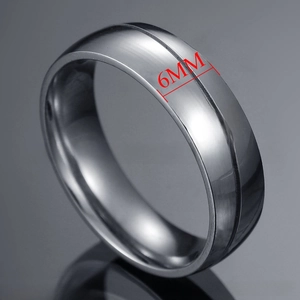 Close-up of a 6mm stainless steel ring featuring a single inset crystal and brushed finish