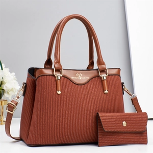 Brown handbag and wallet set with wavy texture and gold accents for women