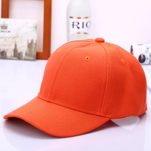 Detail of an orange cotton baseball cap showing twill texture and reinforced stitching