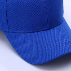 Close-up of navy blue baseball cap showing detailed twill fabric and stitching