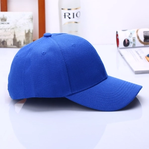 Detail of bright blue twill cotton baseball cap with 6-panel structure and breathable holes