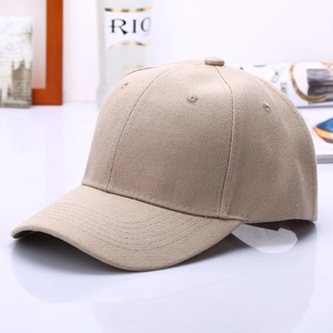 Close-up detail of beige twill cotton baseball cap showing six-panel stitch and curved brim