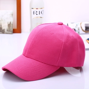 Detail of hot pink cotton twill baseball cap showing fabric texture and curved brim