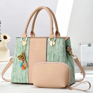 Detail of elegant two-piece handbag set featuring green stripe texture and a mini coin purse