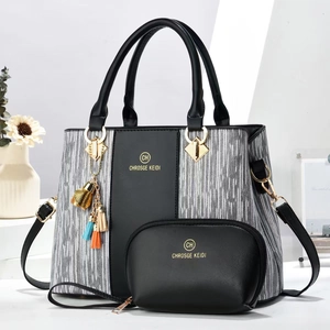 Elegant black striped canvas handbag set with shoulder strap and chic tassel pendant