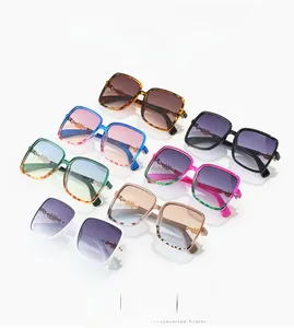 Collection of oversized square sunglasses in multiple colors with gold hinge details