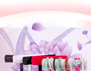 Detail of velvet T-bar display stands featuring jade bangles and quartz watches