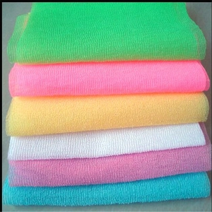 Detailed view of woven nylon exfoliating bath towels in six vibrant assorted colors