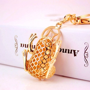 Cute golden frog keychain with pearl accents and honeycomb pattern for women's bags