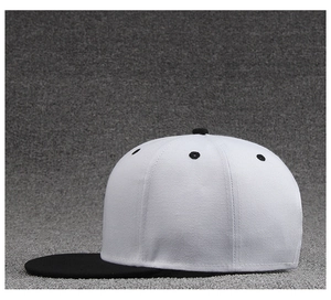 Side view of contrast flat brim baseball cap featuring a white crown and black visor