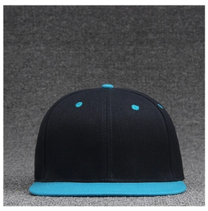 Close-up of a black flat-bill baseball cap with vibrant blue brim and top eyelets