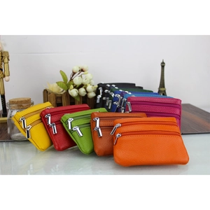 Detailed view of multi-color genuine leather coin purses with multiple zipper compartments