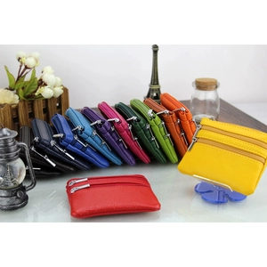 Detailed view of multi-color genuine leather wallets with durable dual zipper design