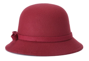 Detailed side view of a vintage dark red wool cloche hat with a delicate bow accent