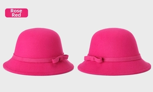 Detailed macro of rose red wool felt cloche hats with decorative ribbon bows