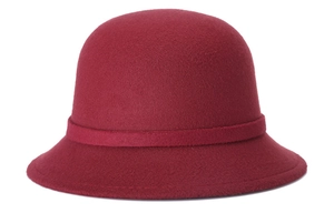 Detail view of the burgundy wool felt cloche hat with a structured round crown and brim