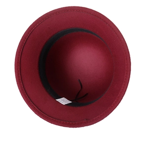 Detail view of red wool fedora interior featuring black sweatband and adjustable strap