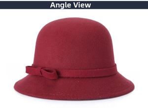Detail of dark red wool cloche hat featuring a decorative ribbon and elegant side bow