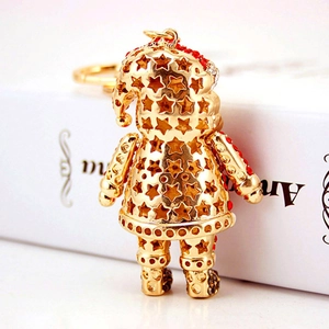 Cute Santa keychain with gold star hollow design and red rhinestones for festive decor