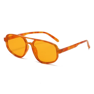 Retro aviator sunglasses with orange transparent lenses and brown tortoiseshell double bridge frame
