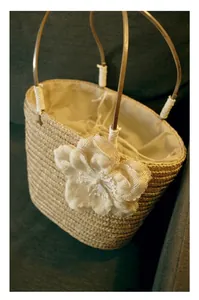 Handmade straw handbag for women with large white fabric flower and woven texture
