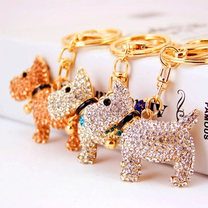 Sparkly rhinestone puppy dog keychain with bell in gold and silver finish for handbags
