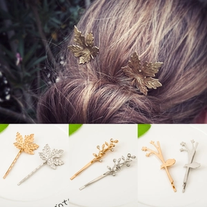 Minimalist leaf hair clips in gold and silver finish for women, featuring maple and branch designs