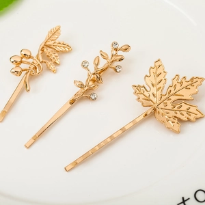 Three-piece gold leaf hair clip set with maple design and sparkling rhinestones