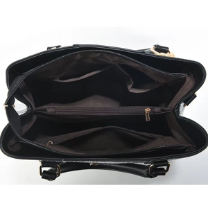 Detailed interior of black PU leather handbag featuring multi-compartment storage and zippers