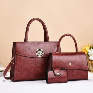 Three-piece dark red tote bag set with metal floral lock and elegant diamond stitching