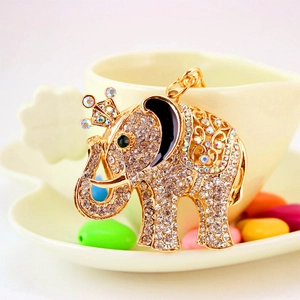 Sparkling crystal elephant keychain with golden crown and black enamel accents