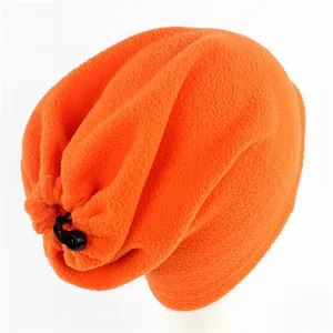 Detail of orange fleece neck warmer with adjustable black drawstring and toggle closure