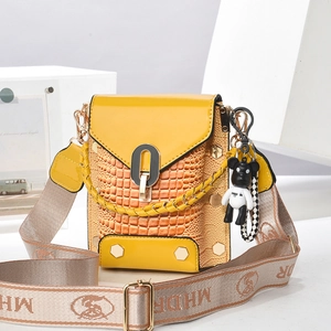 Ginger yellow crocodile pattern mini crossbody bag with wide strap and bear charm