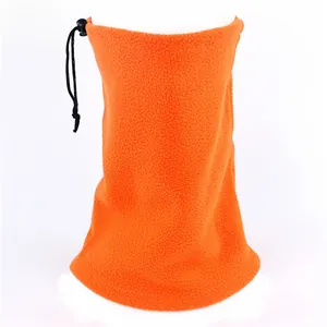 Detail of soft bright orange fleece neck warmer with adjustable black drawstring toggle