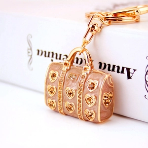 Creative beige enamel handbag keychain with heart patterns and sparkling rhinestones