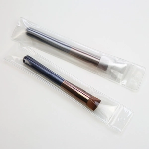 Flat top foundation brush set with deep blue handle and brown synthetic bristles
