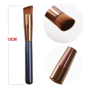 Detail of angled foundation brush with synthetic bristles and 13cm handle length