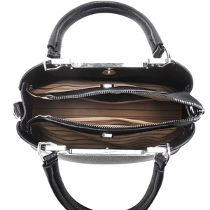 Detail view of large black tote bag featuring three compartments and silver magnetic closure