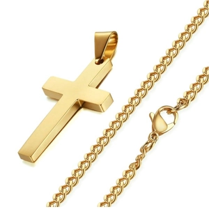 Detail shot of a polished gold cross pendant with a matching woven metal chain and clasp