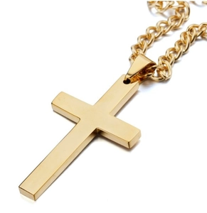 Detailed view of a minimalist golden cross pendant with a matching Cuban link chain