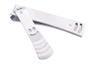 Macro view of stainless steel nail clipper showing creative smiley face handle and texture