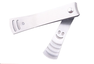 Close-up of stainless steel nail clipper set with smiley face design and non-slip handles