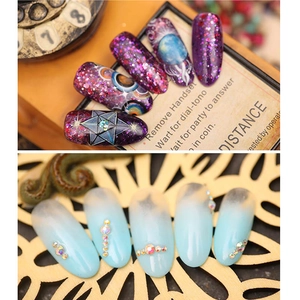 Press-on nails set with purple galaxy glitter and blue gradient rhinestone designs
