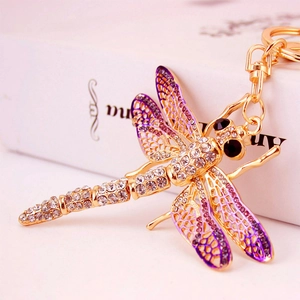 Golden dragonfly keychain with purple enamel wings and sparkling rhinestones for handbags