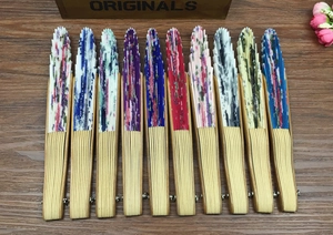 Detailed top view of 10 assorted Japanese shell-shaped folding fans with bamboo ribs