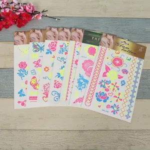 Fluorescent flower and butterfly tattoo stickers with bright neon colors and feather designs